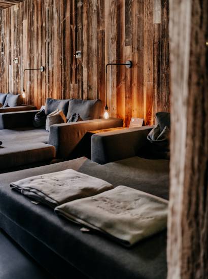 waldSPA adults only lounges in front of wooden wall